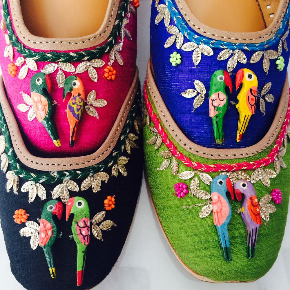Photo of parrot detailing on flat shoes