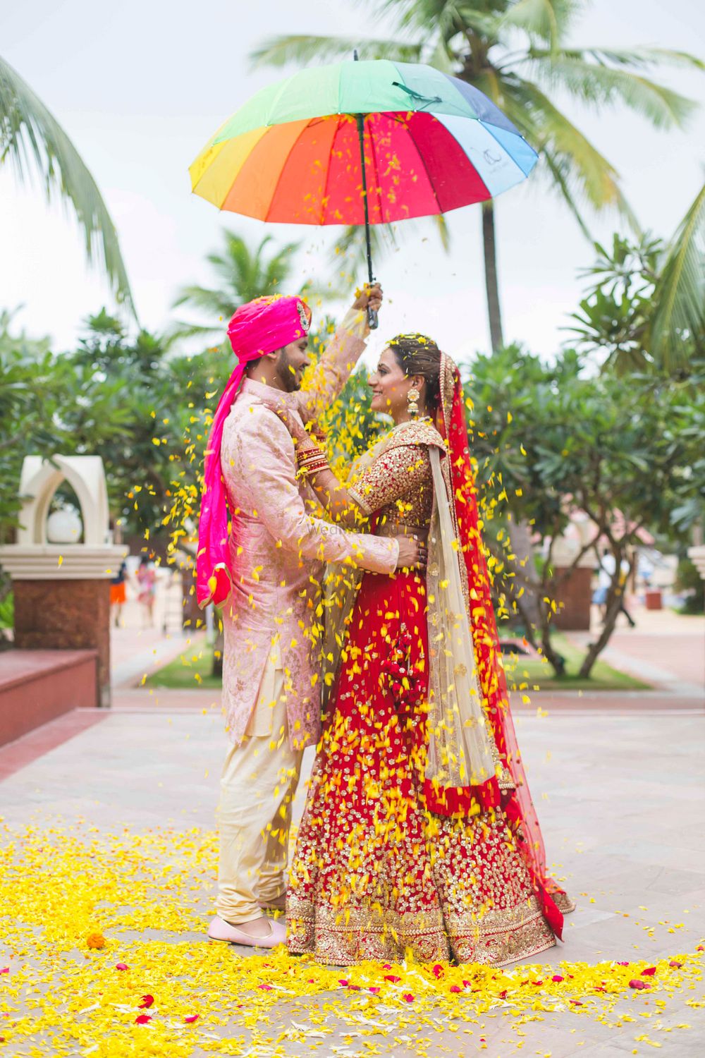 Photo of Couple Portrait with Umbrella and Petals