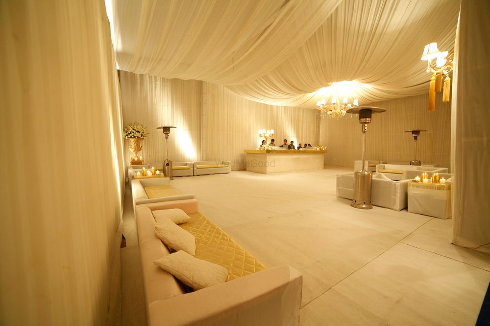 Photo of elegant and subtle engagement or reception theme with white and gold