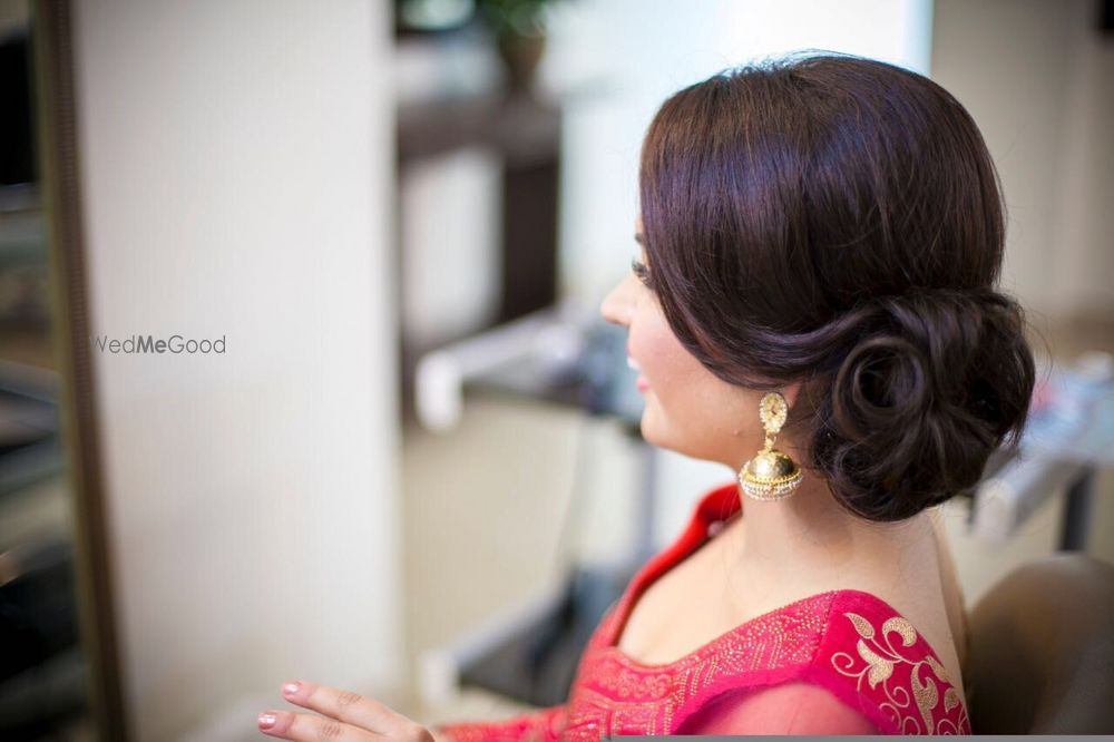 Photo of Side structured bun with curls