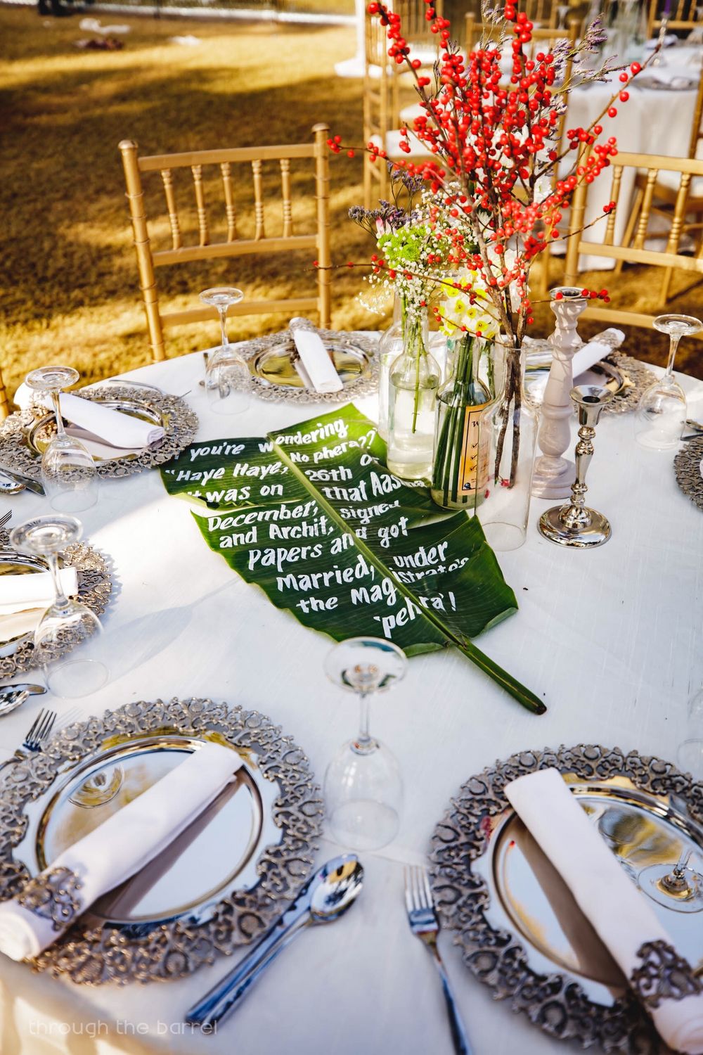 Photo of Unique table setting with handwritten note on banana leaf by couple