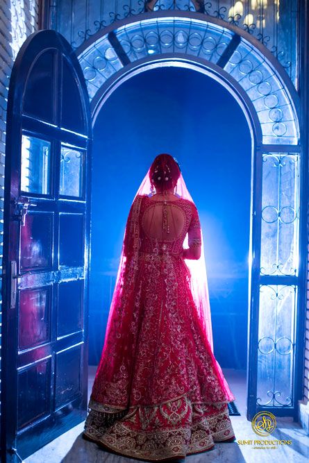 Photo of Bridal entry shot with bride standing on doorway