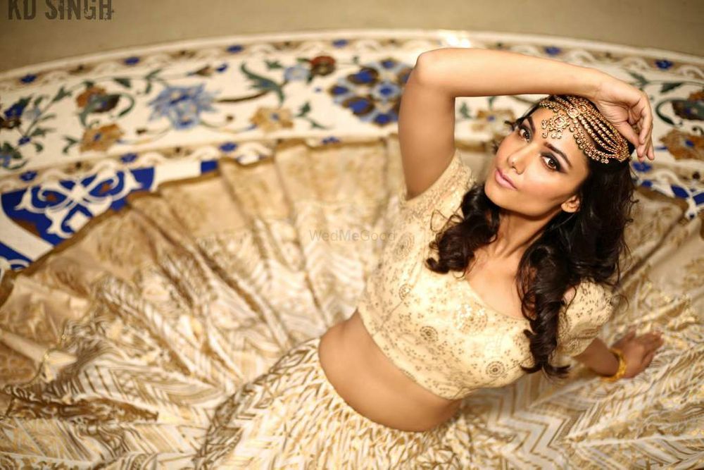 Photo of Gold Lehenga with Blue Floral Border