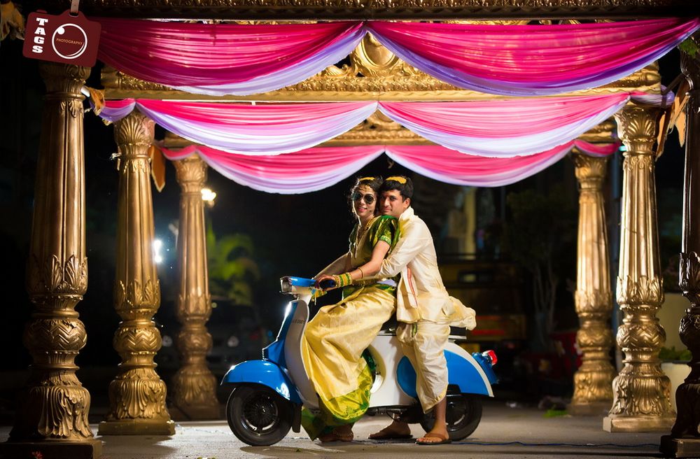Photo of South indian wedding couple on vespa