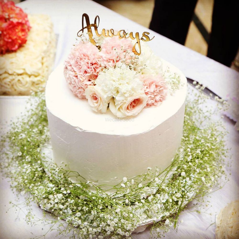 Photo of wedding cake with flowers
