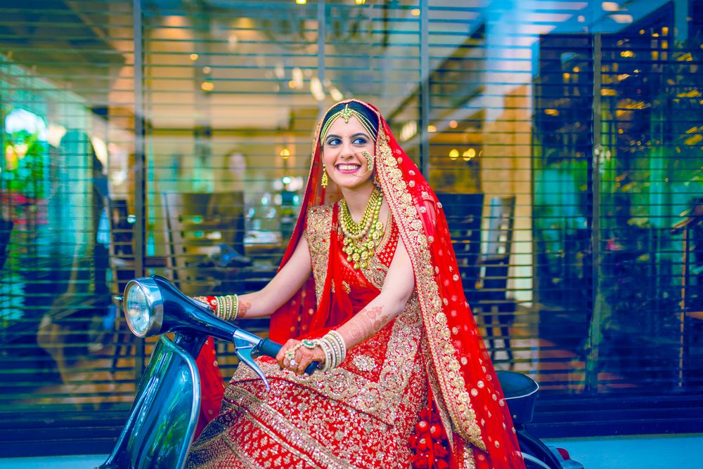 Photo of Bride posing on scooter