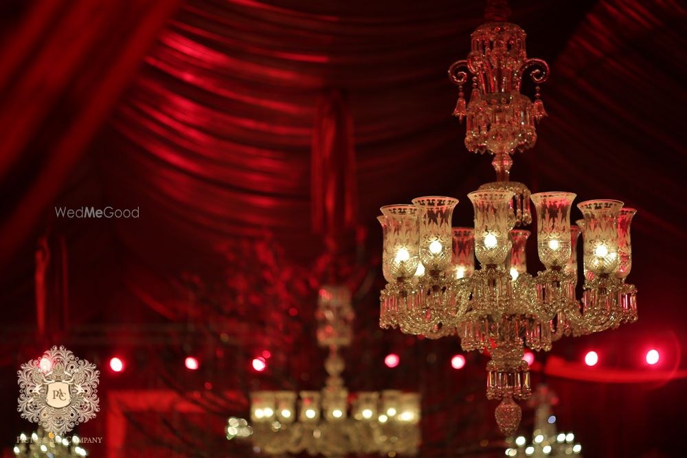 Photo of Royal glass chandelier with candles in decor