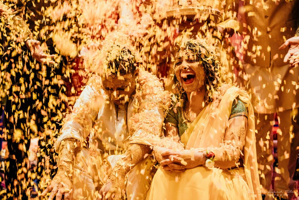 Photo of crazy haldi photo with a happy bride and groom