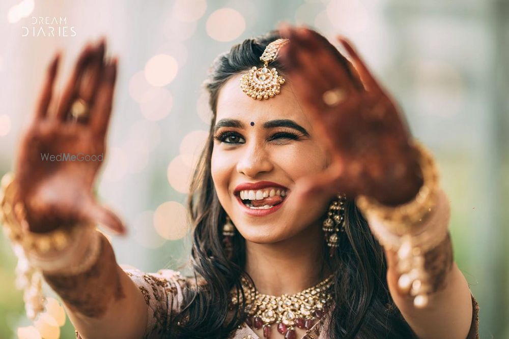 Photo of Bride making goofy faces and posing for the camera.