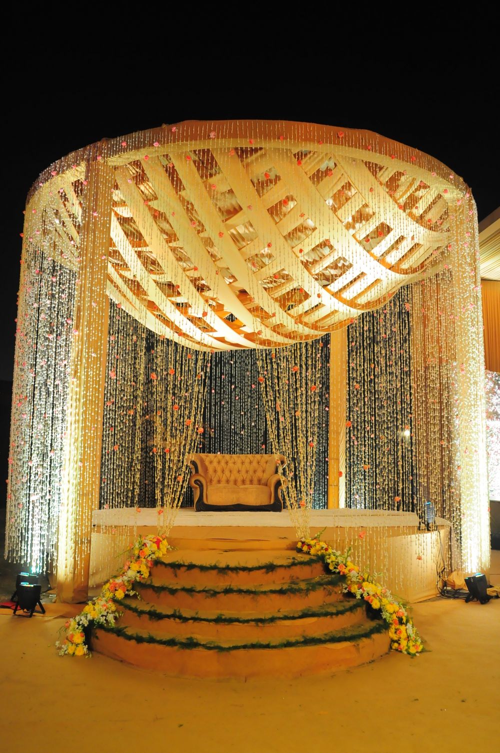 Photo of A dome-shaped mandap decorated with floral strings.