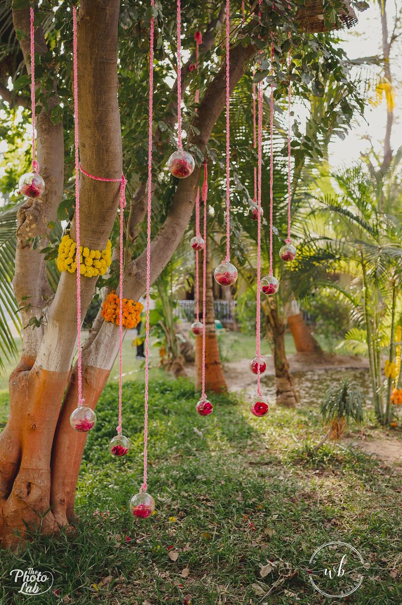 Photo of hanging orbs with florals for tree decor