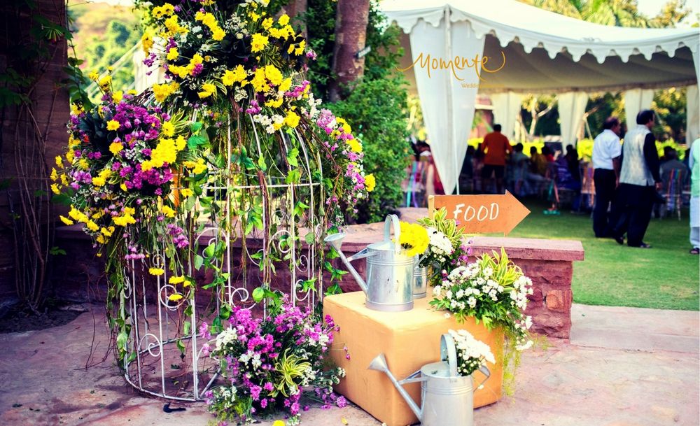 Photo of Giant birdcage with floral arrangement for mehendi