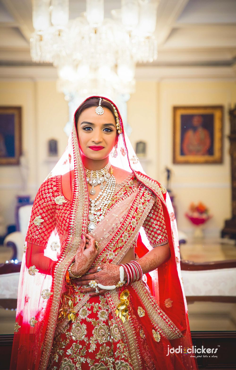 Photo of Bride in red and silver lehenga