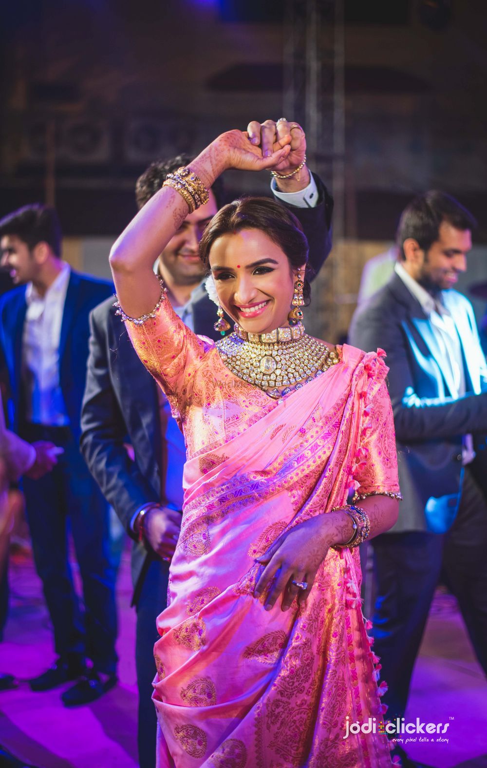 Photo of Bride in light pink saree with vintage choker necklace