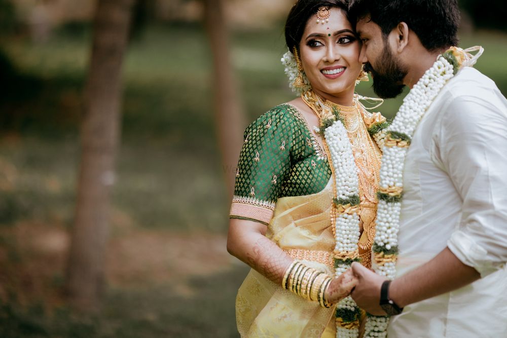 Photo of south indian bride in gold saree with green blouse