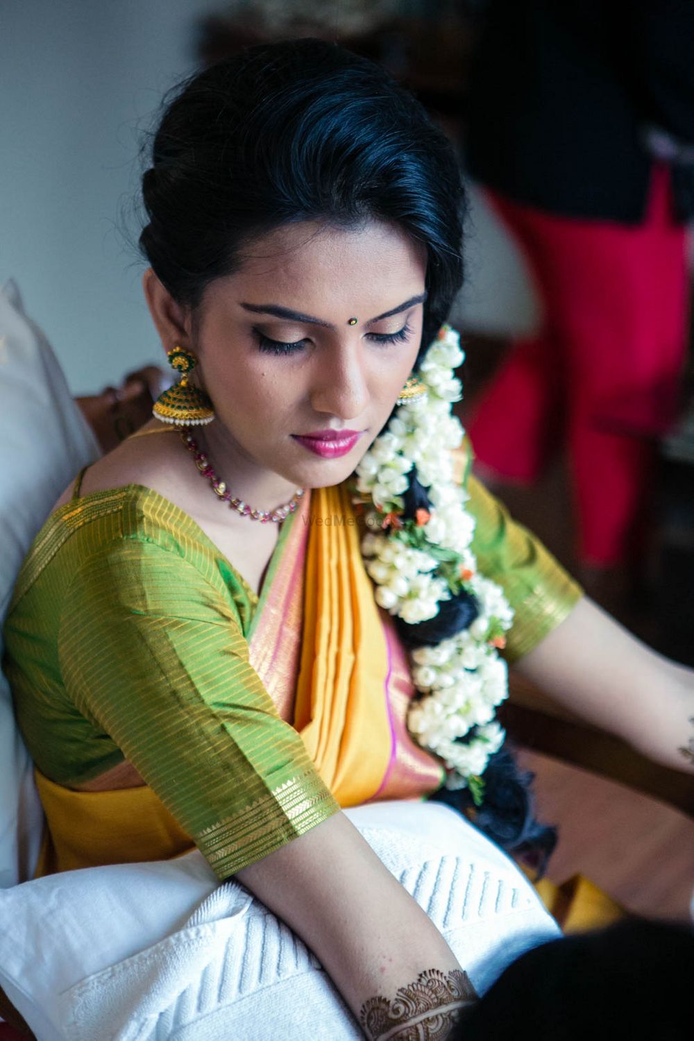 Photo of Mehendi hairstyle with side braid and mogra strings