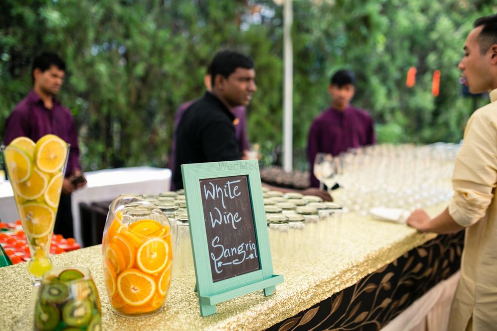 Photo of Bar table setting with chalkboard and fruit display