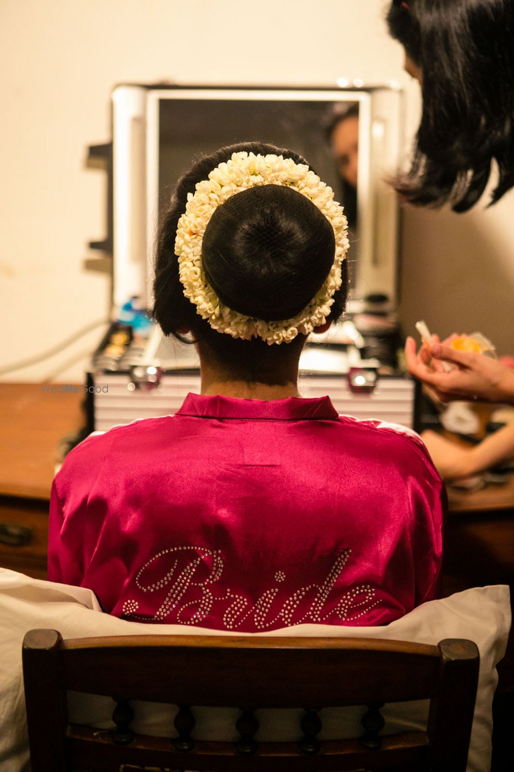 Photo of Bridal bun with mogra flowers around it