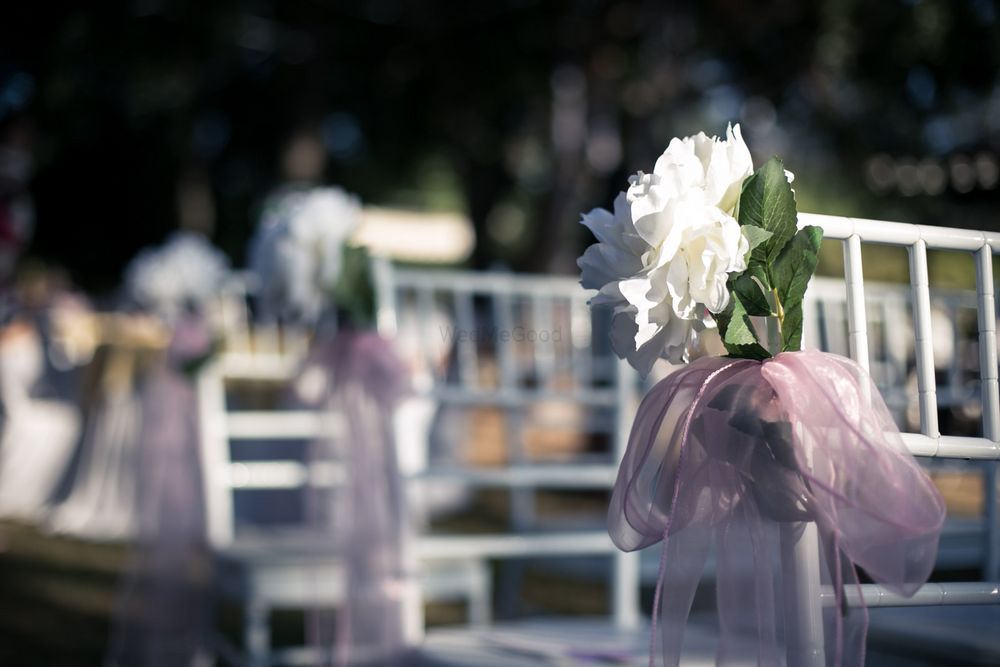 Photo of Chair decor idea with light pink cloth and white flower