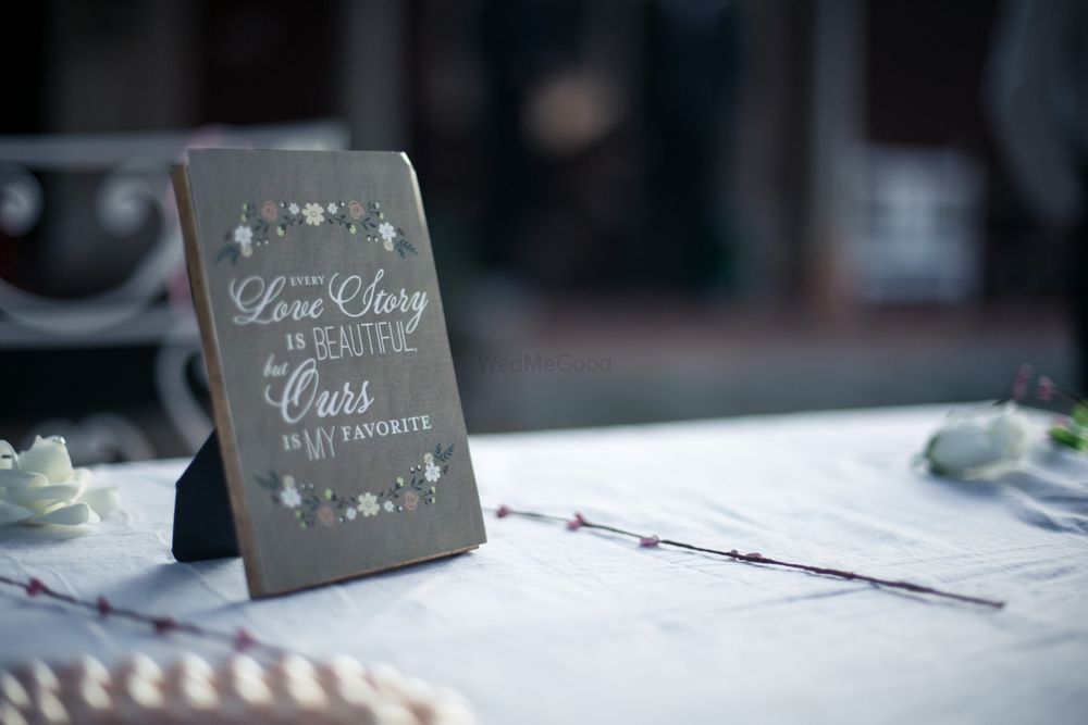 Photo of Frame on table top with cute saying