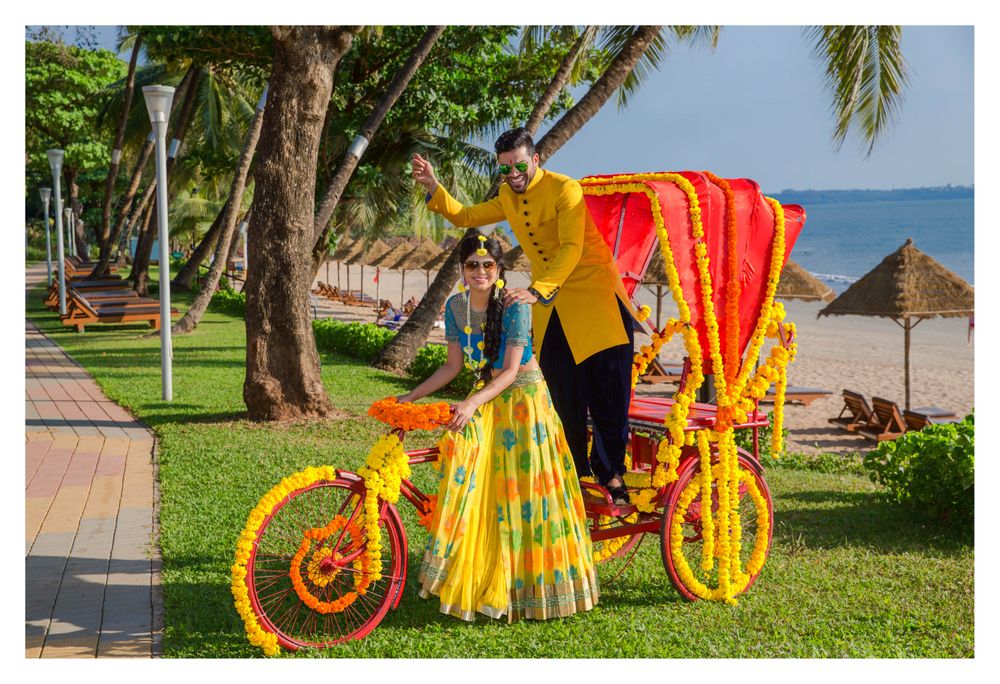 Photo of Decorated yellow and orange rickshaw at mehendi