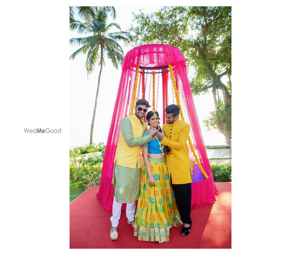 Photo of Bright pink and yellow mehendi decor mandap