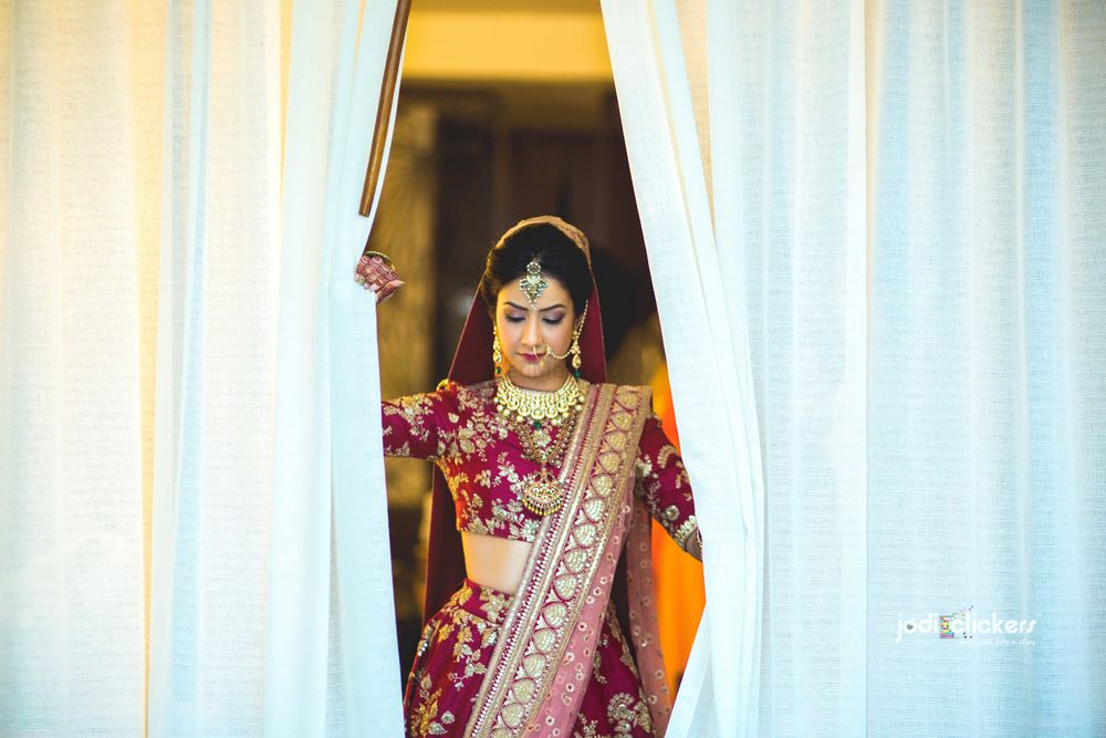 Photo of Bride looking at of window