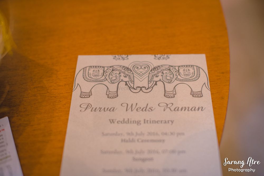 Photo of White wedding itinerary with elephant motifs