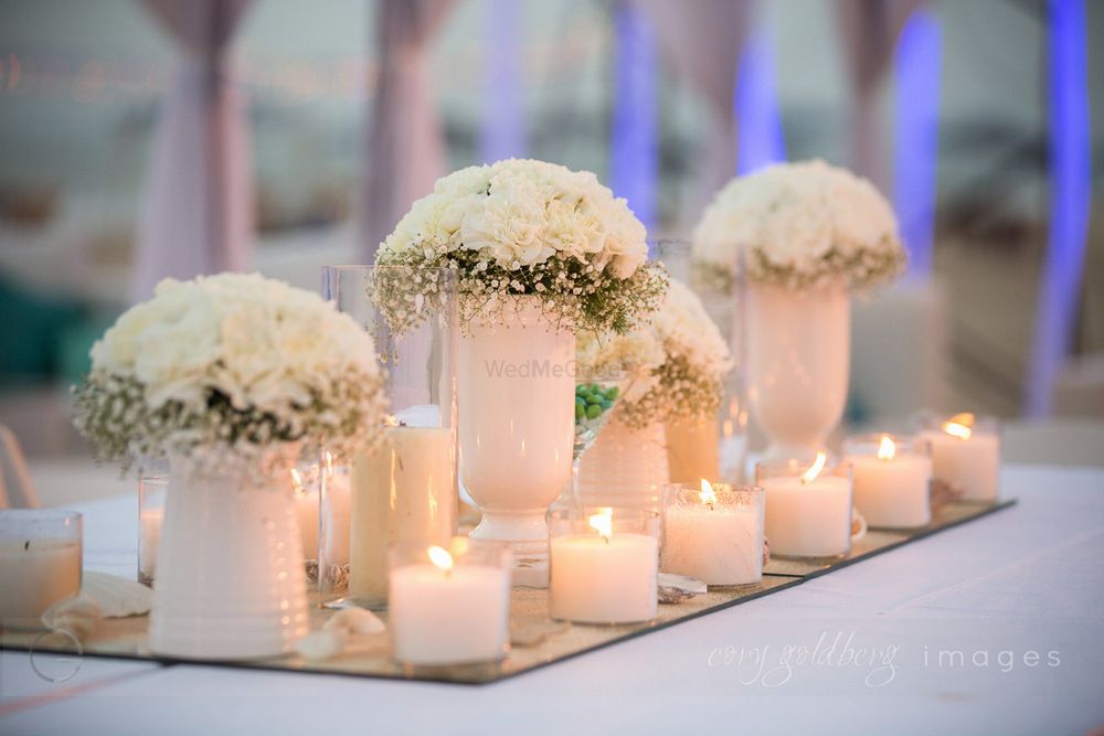 Photo of Pretty all white table setting with candles