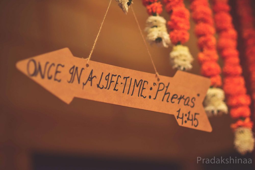 Photo of Handwritten direction board and time for pheras