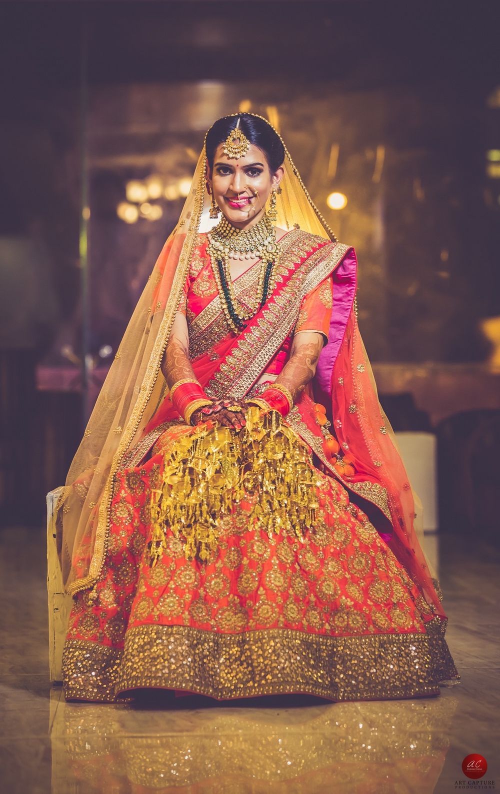 Photo of Orange and gold bridal lehenga with pink dupatta