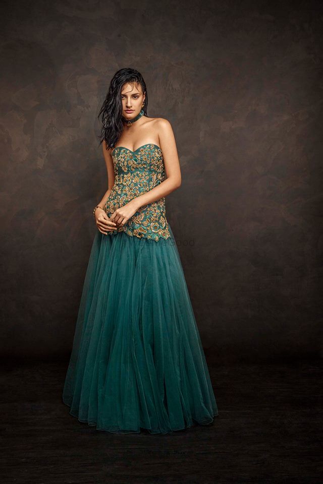 Photo of teal blue floor length gown with toulle