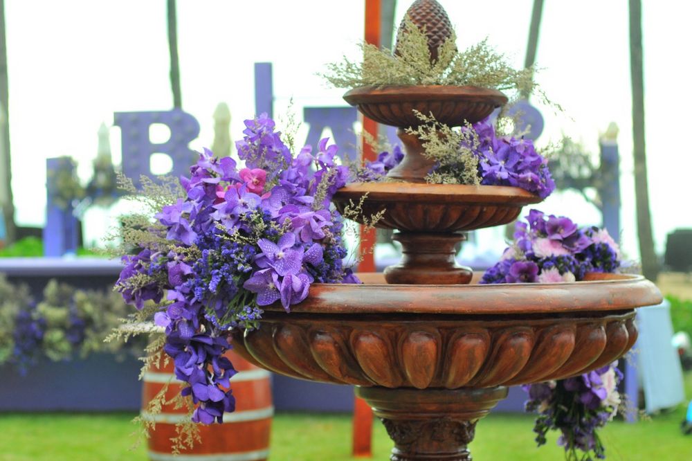 Photo of Purple flowers on fountain