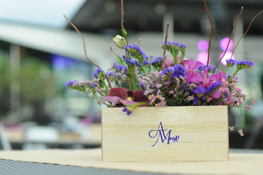 Photo of Wooden crate floral arrangement as centerpiece