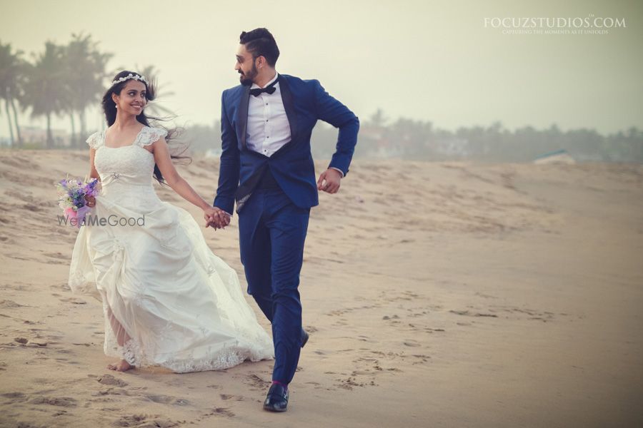 Photo of beach side couple portrait