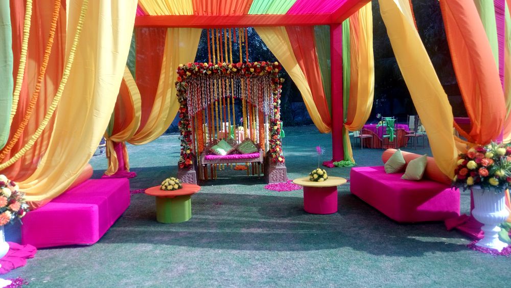 Photo of hanging floral strings stage decor for mehendi