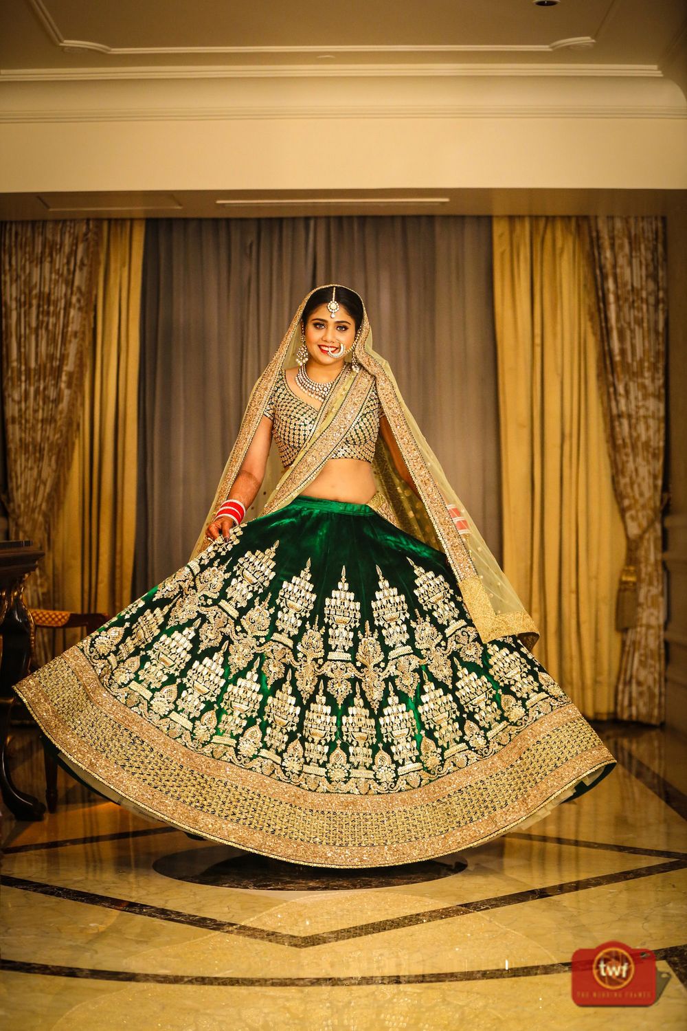 Photo of Twirling bride in shades of green