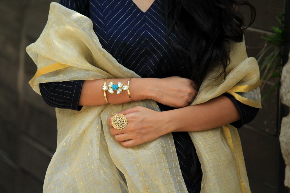 Photo of Modern bangle in gold with blue stone