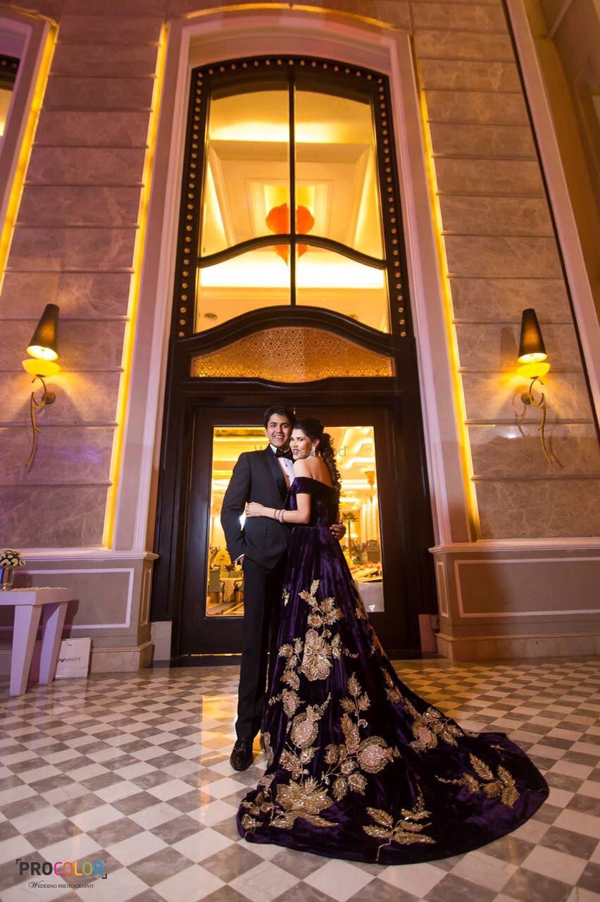 Photo of purple and gold motifs gown