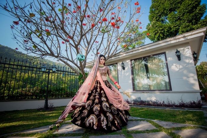 Photo of Offbeat bridal lehenga with deep maroon velvet skirt