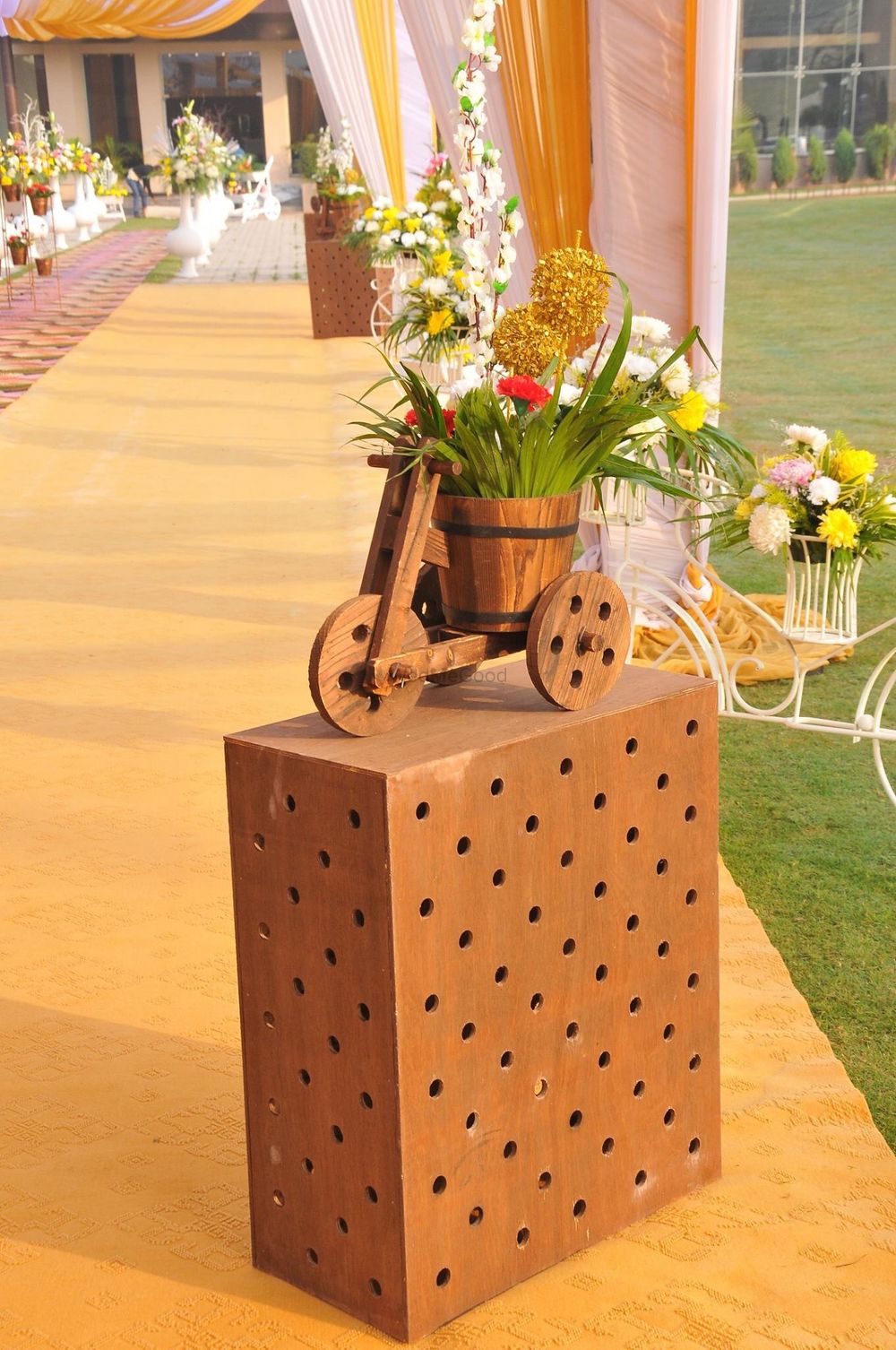 Photo of wooden cycle and box entrance decor