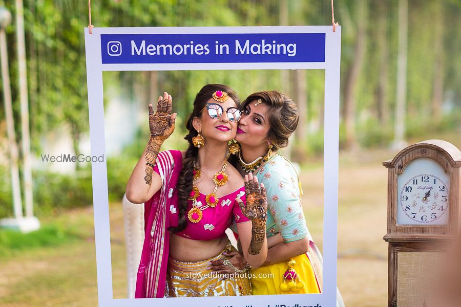 Photo of Fun bridal mehendi portrait with sister in instagram photobooth