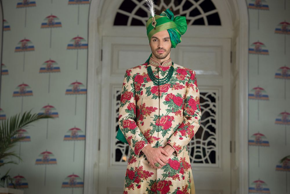 Photo of White red and green floral print sherwani with green safa