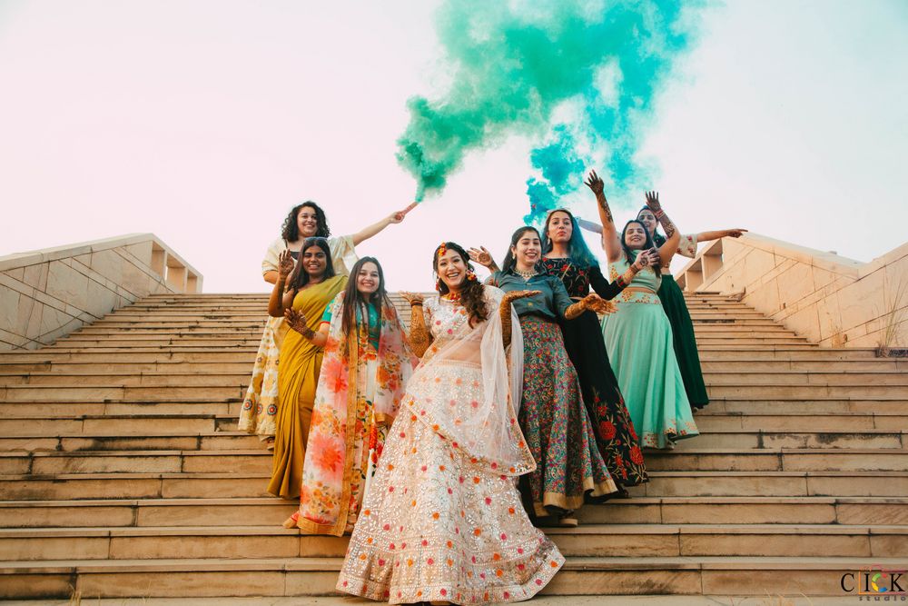 Photo of Bride with bridesmaids with smoke bombs