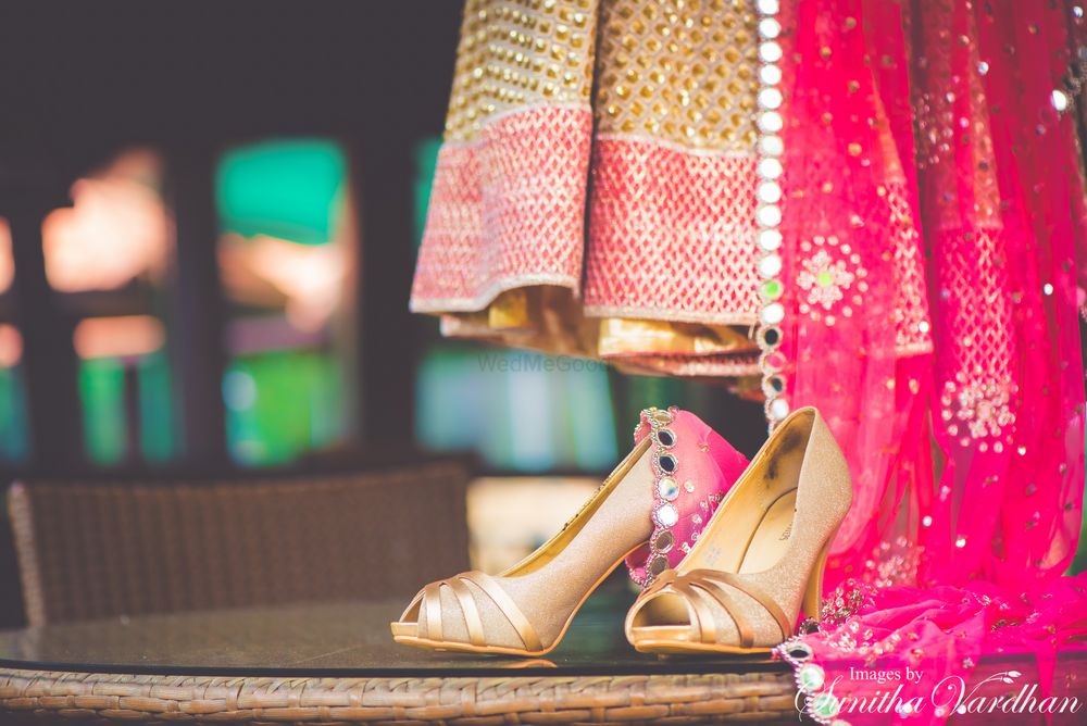 Photo of Pink bridal lehenga with gold peep toe heels
