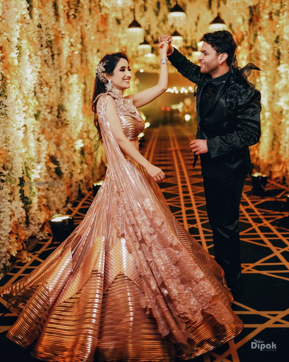 Photo of Groom twirling the bride.