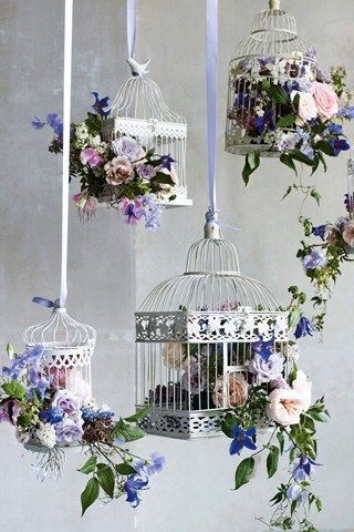 Photo of hanging white floral birdcage decor
