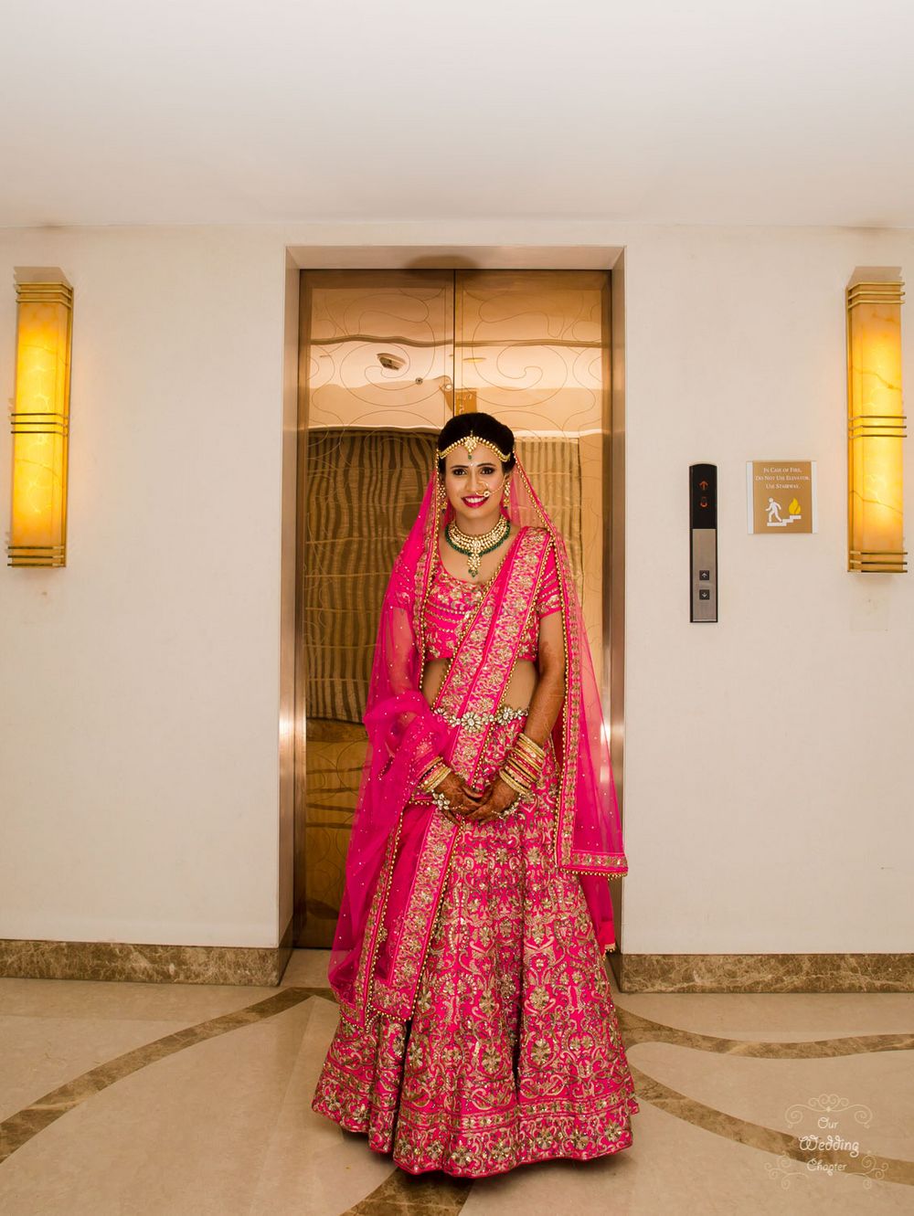 Photo of Bright pink bridal lehenga with floral embroidery