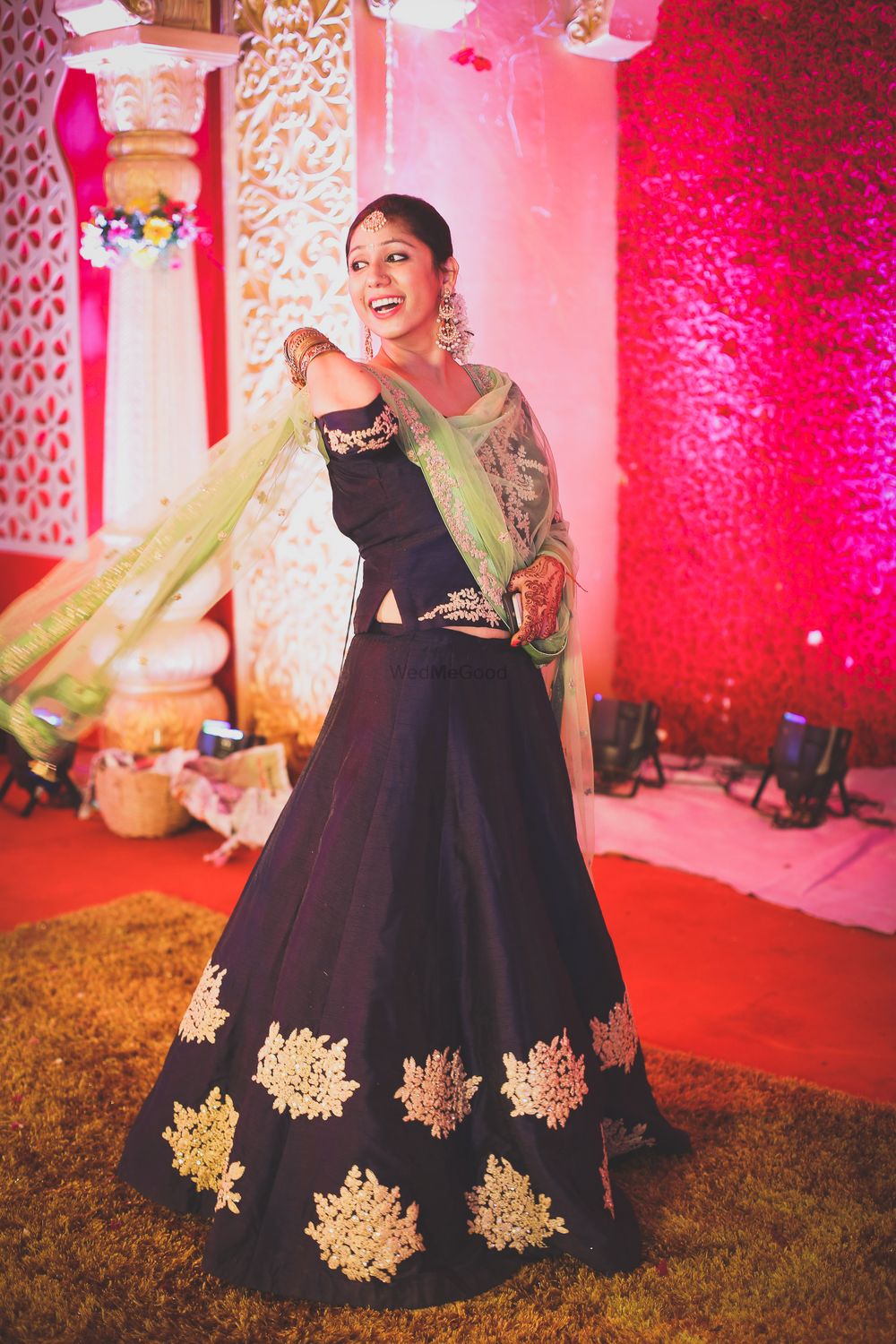 Photo of Sister of the groom wearing purple lehenga with green dupatta