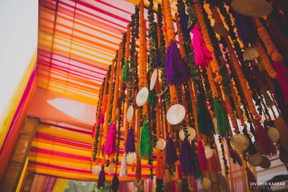 Photo of hanging pompoms mehendi decor